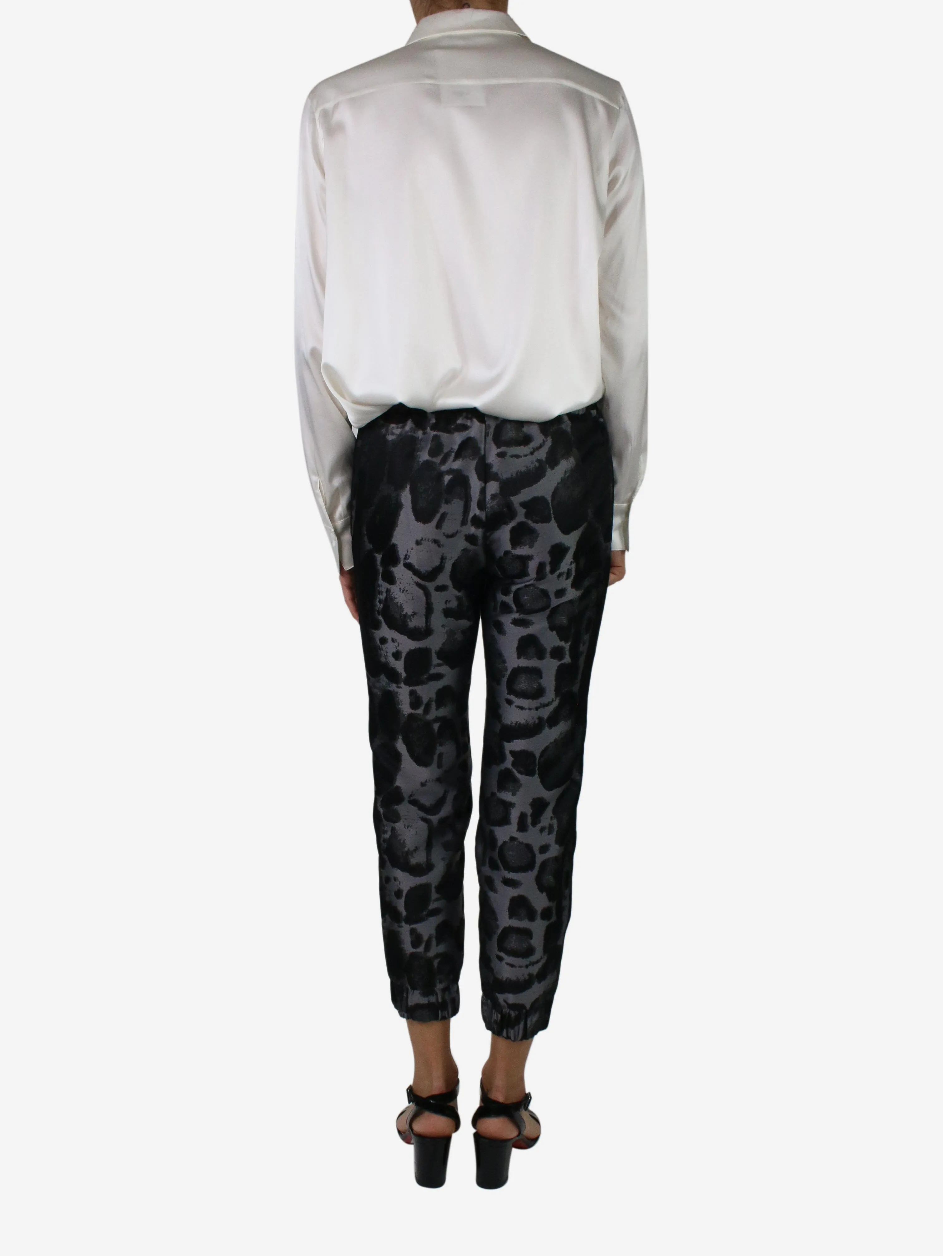 Black elasticated animal print trousers - size XS