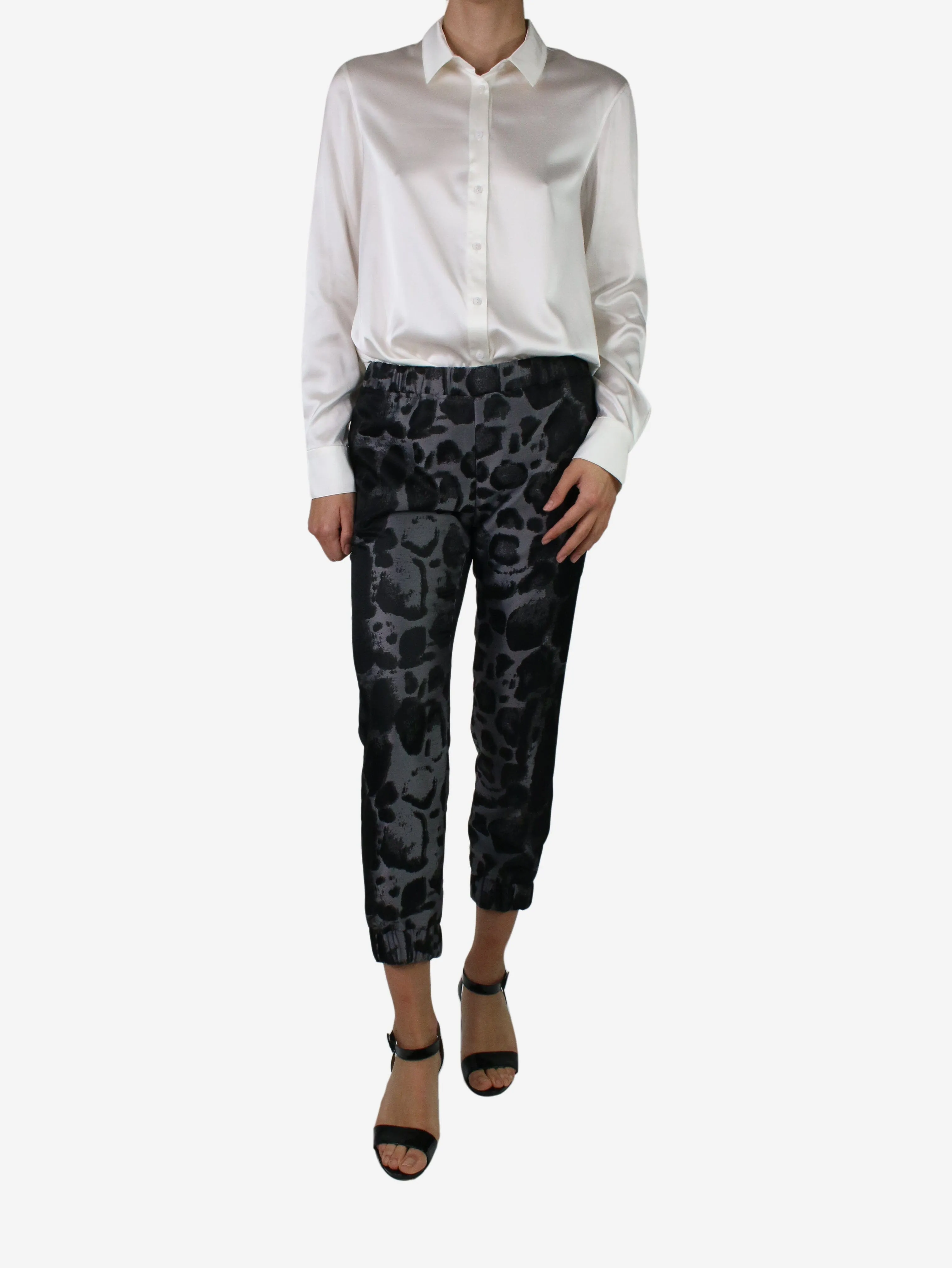 Black elasticated animal print trousers - size XS